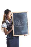 Smiling businesswoman holding a blackboard