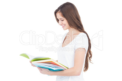 Smiling female college student studying