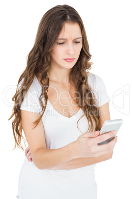 Worried woman using her smartphone