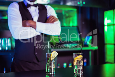 Two glasses of gin on bar counter