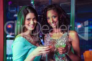 Portrait of two women having cocktail