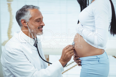 Doctor examining pregnant woman