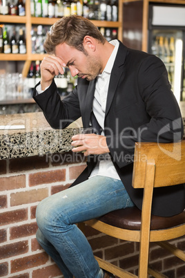 Tired man having a whiskey