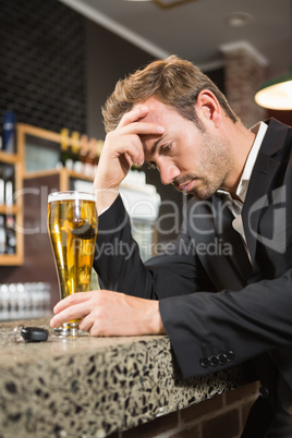 Tired man having a beer