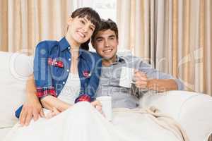 Couple at home relaxing on the sofa