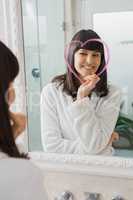 Beautiful young woman reflection in mirror