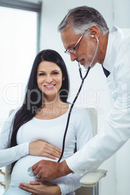 Doctor examining pregnant woman