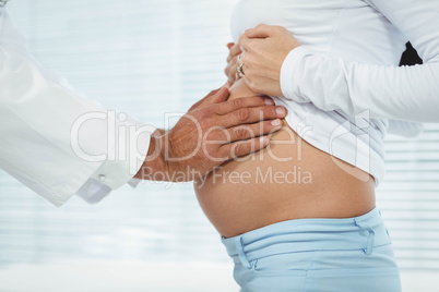 Doctor examining pregnant woman