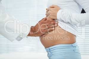 Doctor examining pregnant woman