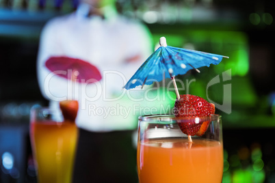 Two glasses of cocktail on bar counter