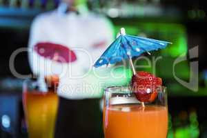 Two glasses of cocktail on bar counter