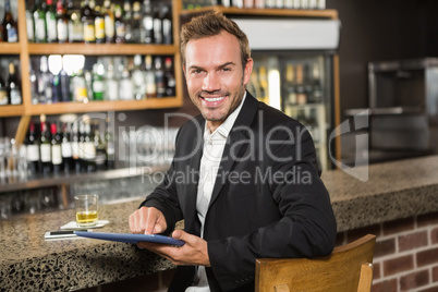 Handsome man using tablet computer