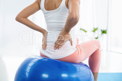 Pregnant woman exercising on exercise ball