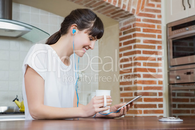 Young woman listening to music on smartphone