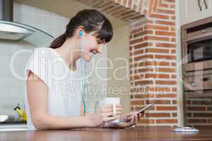 Young woman listening to music on smartphone