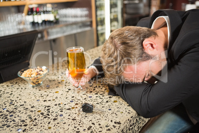 Tired man having a beer