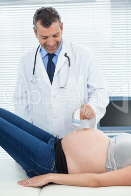 Pregnant woman receiving ultrasound treatment