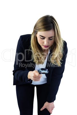 Woman using magnifying glass