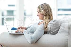 Pregnant woman using laptop