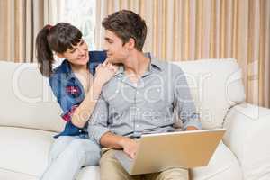 Young couple using a laptop