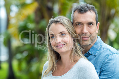 Couple looking away and smiling