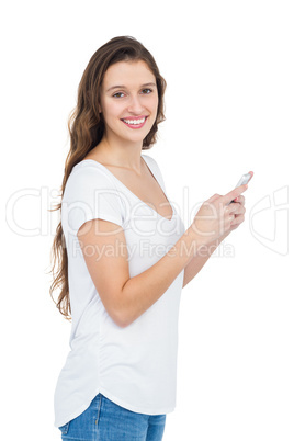 Smiling woman using her smartphone