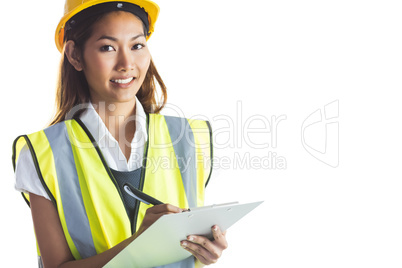 Architect woman with yellow helmet and plans