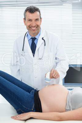 Pregnant woman receiving ultrasound treatment