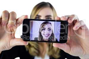 Smiling woman taking selfie