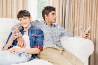 Couple at home relaxing on the sofa