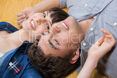 Couple at home relaxing on the floor