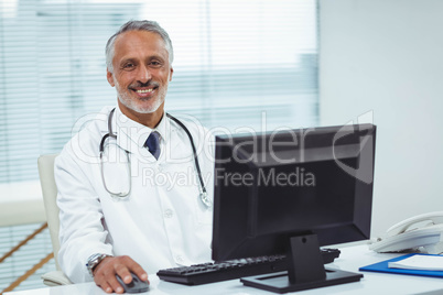 Doctor working on his computer