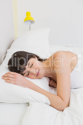 Young woman relaxing on bed