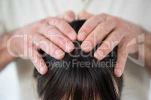 Close-up of woman receiving a head massage