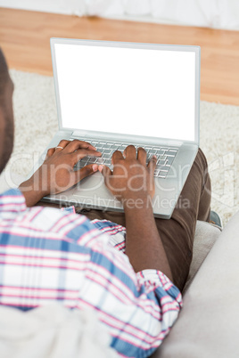 Man using laptop at home