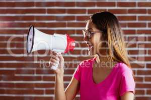 Asian woman shouting in megaphone