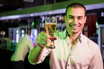 Man posing with glass of beer