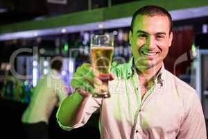 Man posing with glass of beer