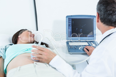 Pregnant woman undergoing ultrasound test