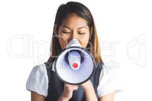 Businesswoman shooting through a megaphone