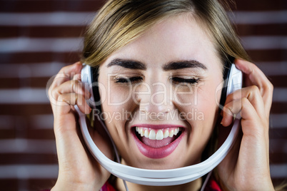 Pretty blonde woman listening to music