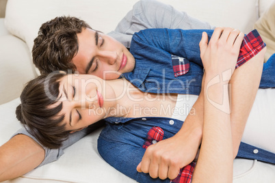 Couple at home relaxing on the sofa