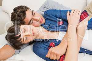 Couple at home relaxing on the sofa