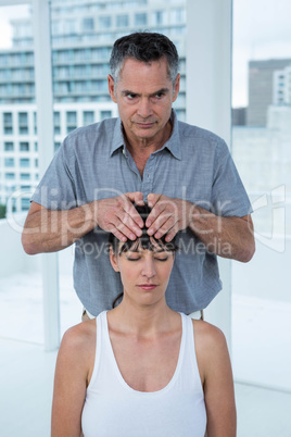 Pregnant woman receiving a massage from masseur