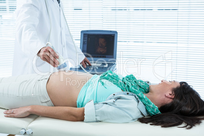 Pregnant woman undergoing ultrasound test