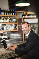 Handsome man using laptop computer