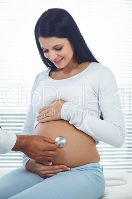 Doctor examining pregnant woman