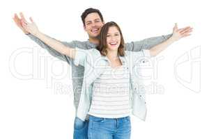 Couple embracing with arms out