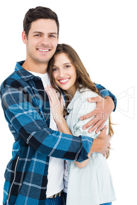 Cute couple embracing and looking the camera