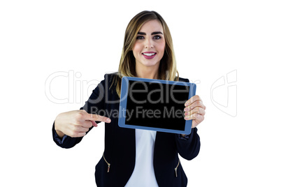 Smiling woman pointing on tablet